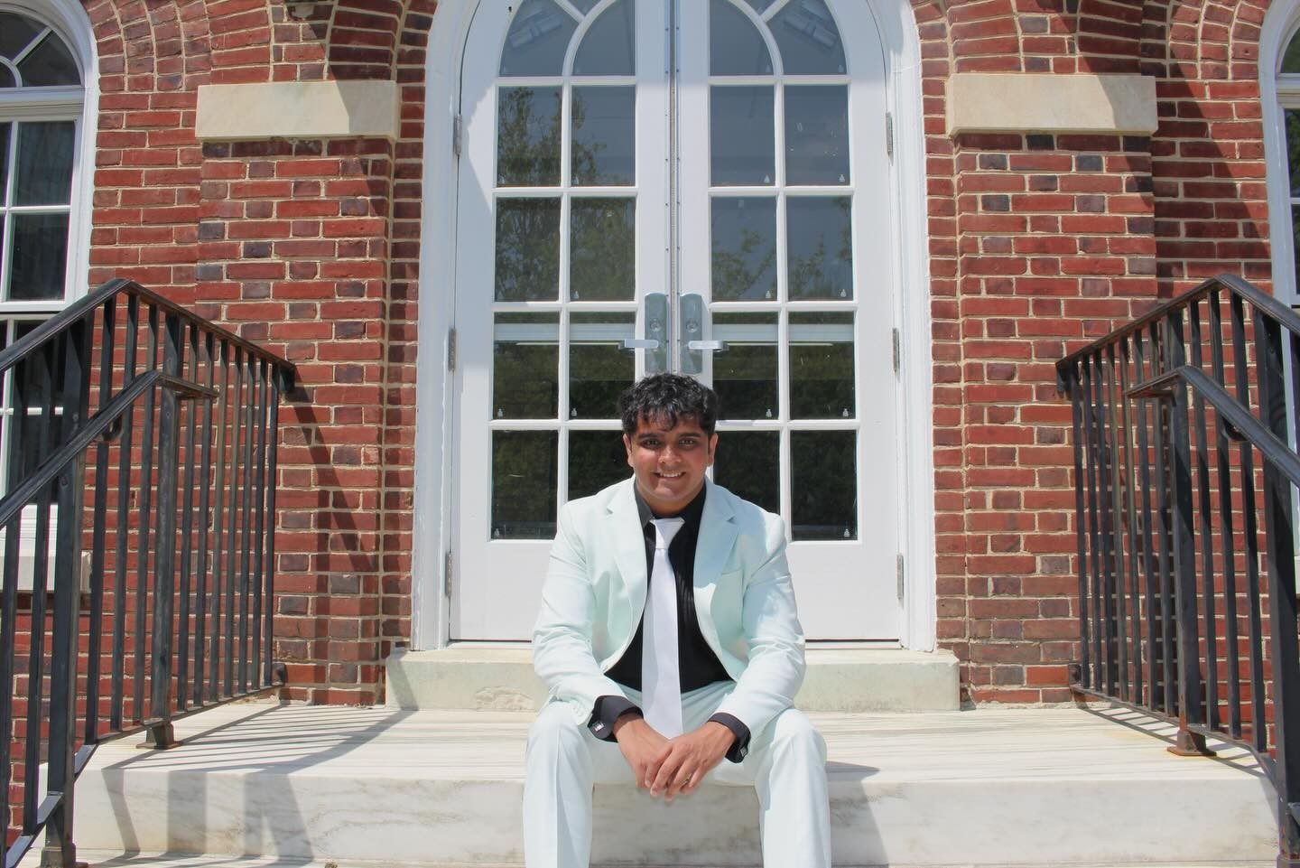 Preet Desai on the Rowan campus after graduation