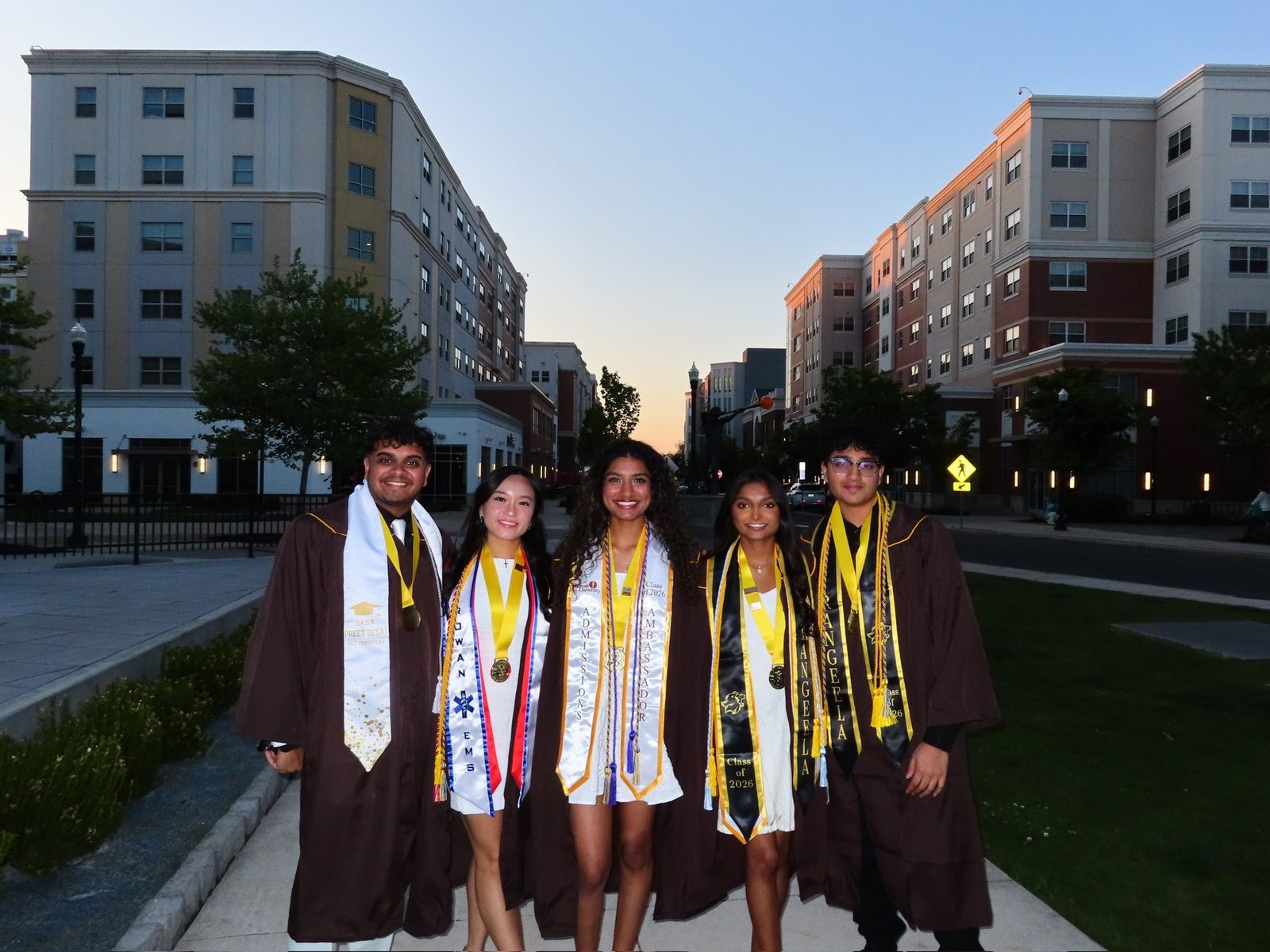 Preet Desai and classmates in Rowan graduation attire