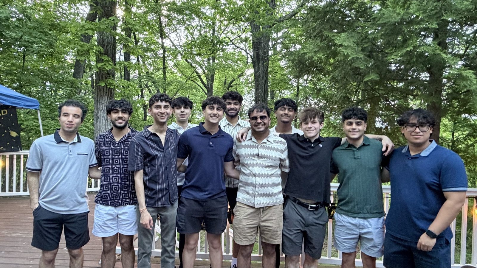 Friends lined up on an outdoor deck